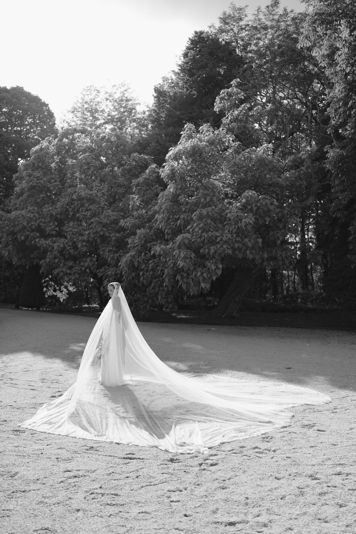Isadora & Hugo — the bride's veil spread across the ground, spring wedding in Nouvelle-Aquitaine
