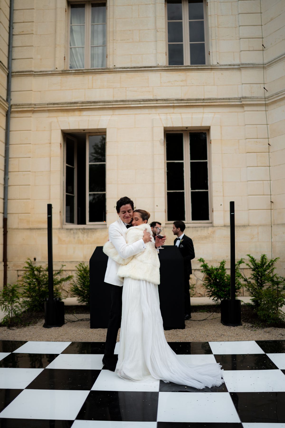 Isadora & Hugo — the couple on the black and white chequered dance floor, spring wedding in Nouvelle-Aquitaine