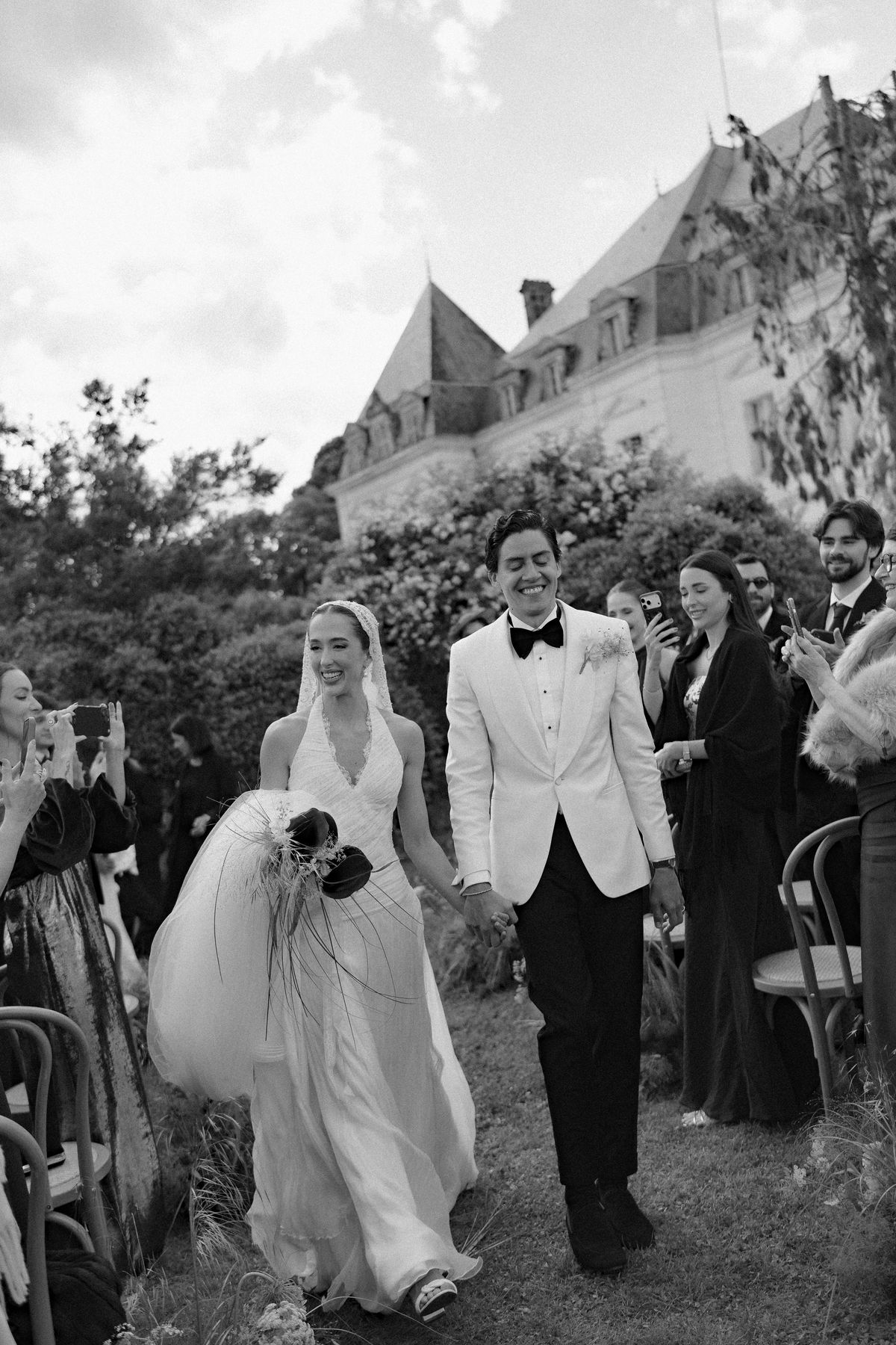Isadora & Hugo — the couple walking back through the guests, spring wedding in Nouvelle-Aquitaine