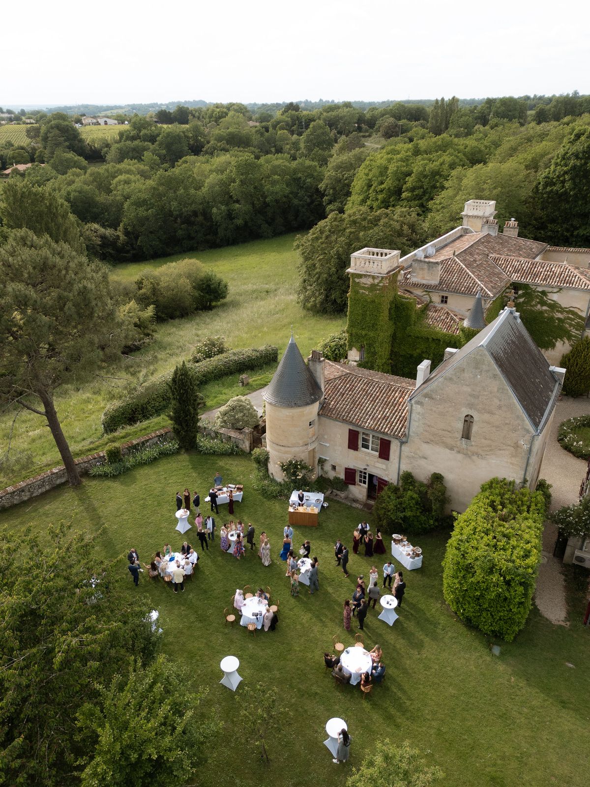 An aerial view of Château Sentout with the reception tables set on the lawn