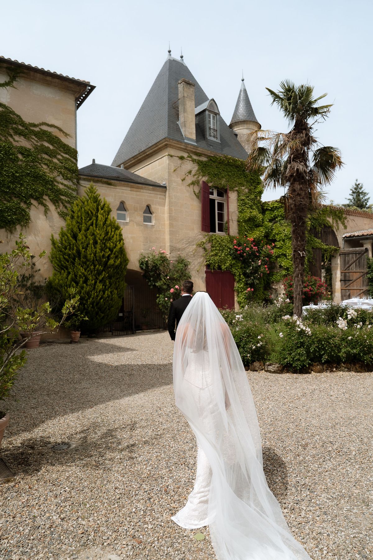A turret of Château Sentout among the trees