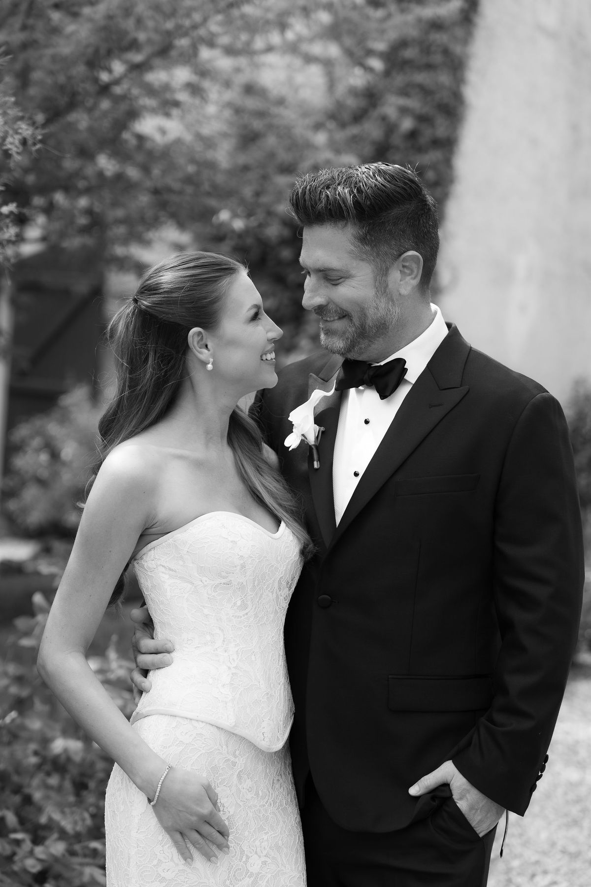 A black-and-white photo of Jori and JD close together