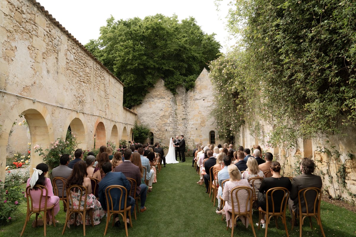 Guests seated for the ceremony as Jori and JD stand at the altar