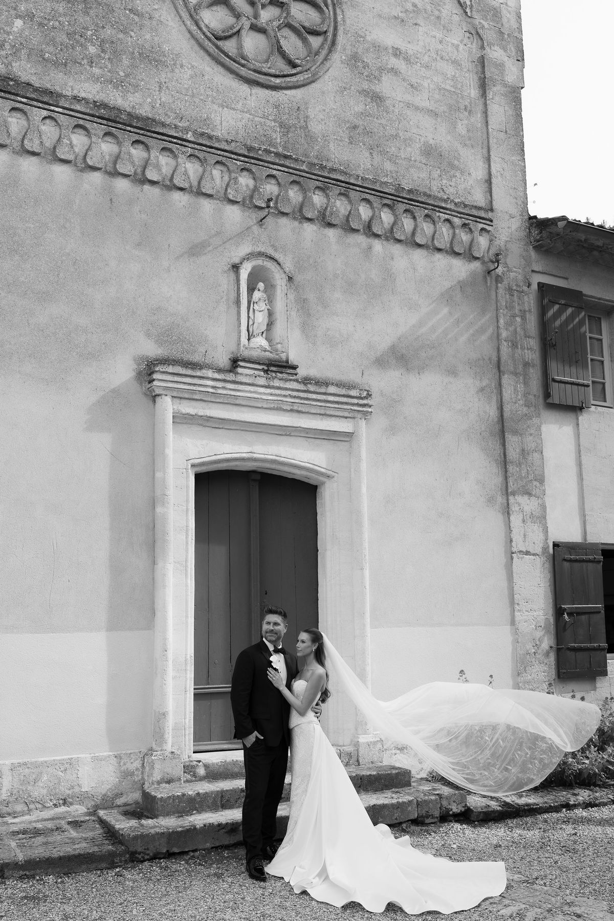 Jori and JD standing together outside the chapel entrance