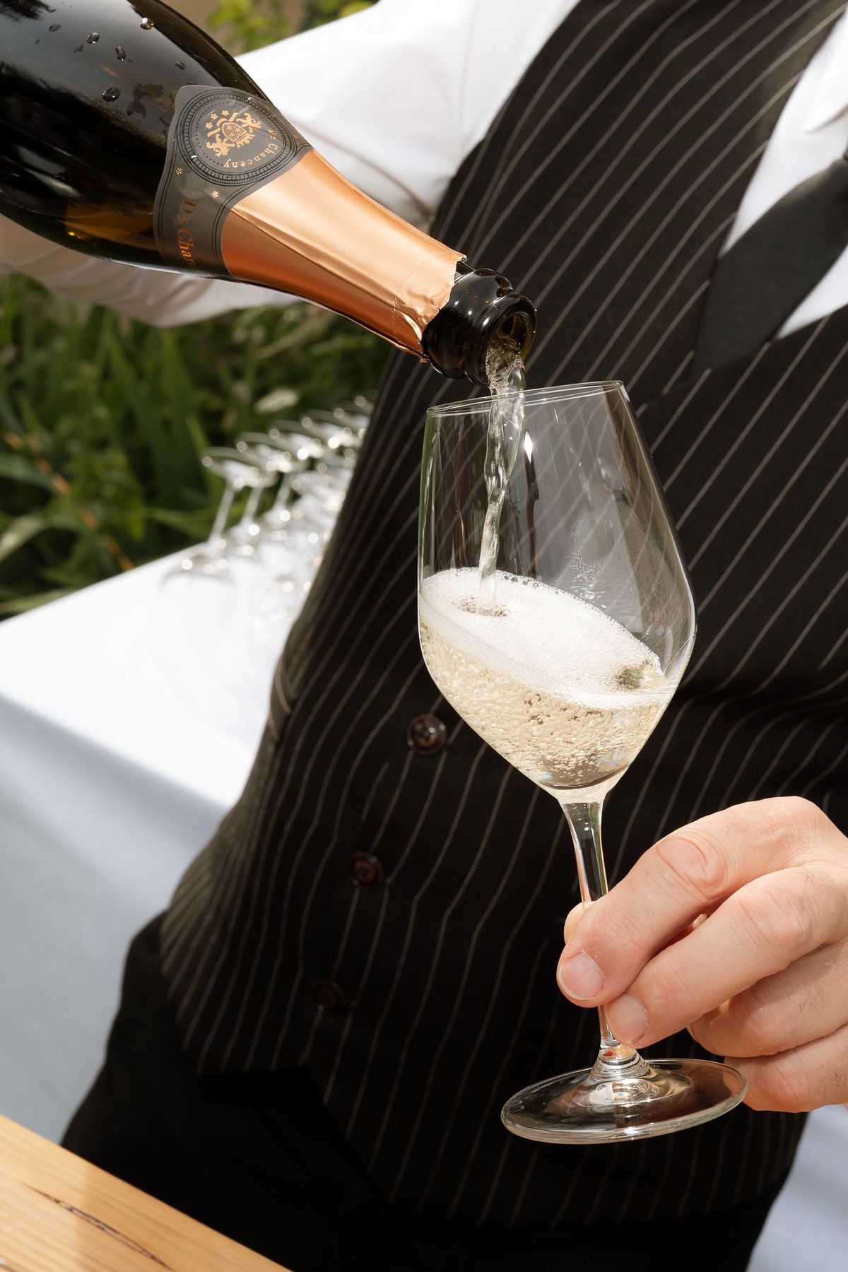 A close-up of champagne being poured into a glass