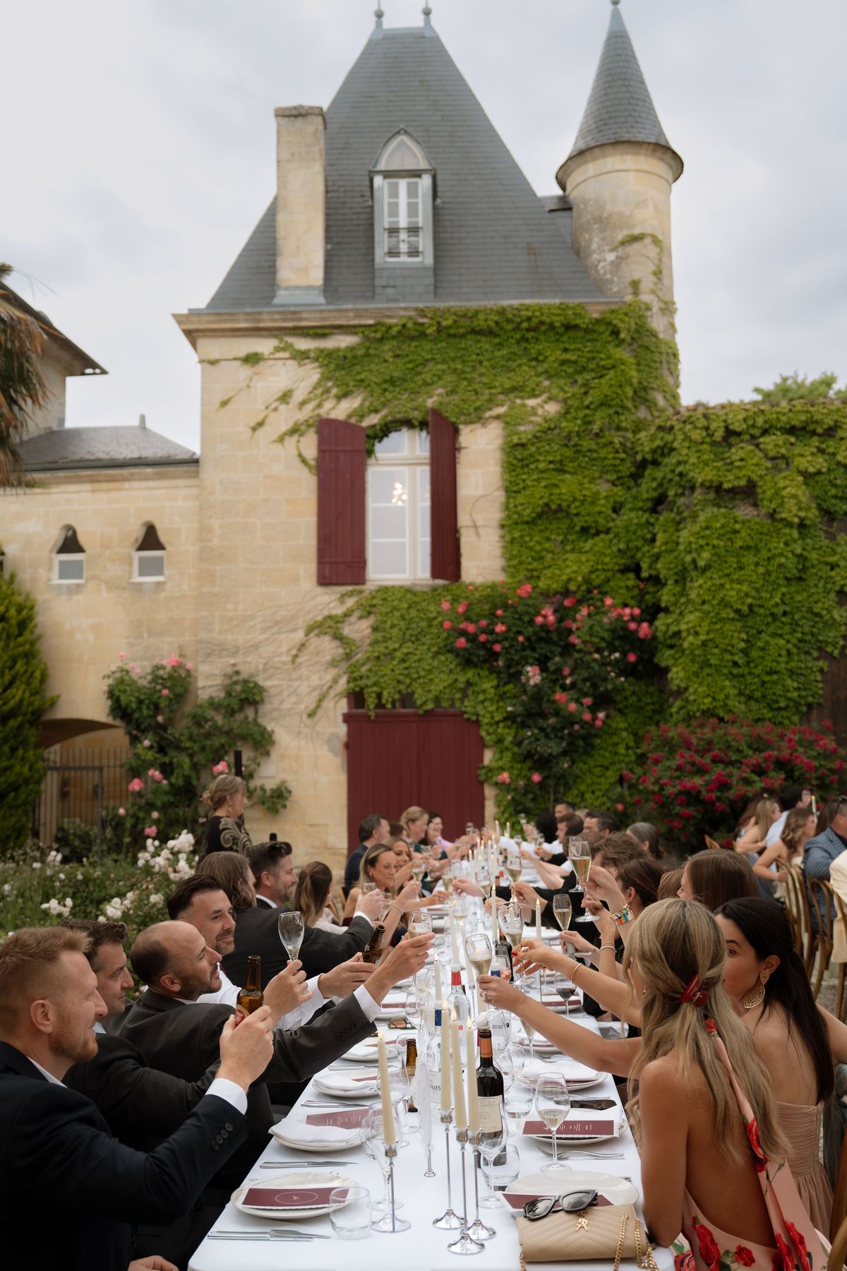 Guests raising their glasses in a toast during the reception