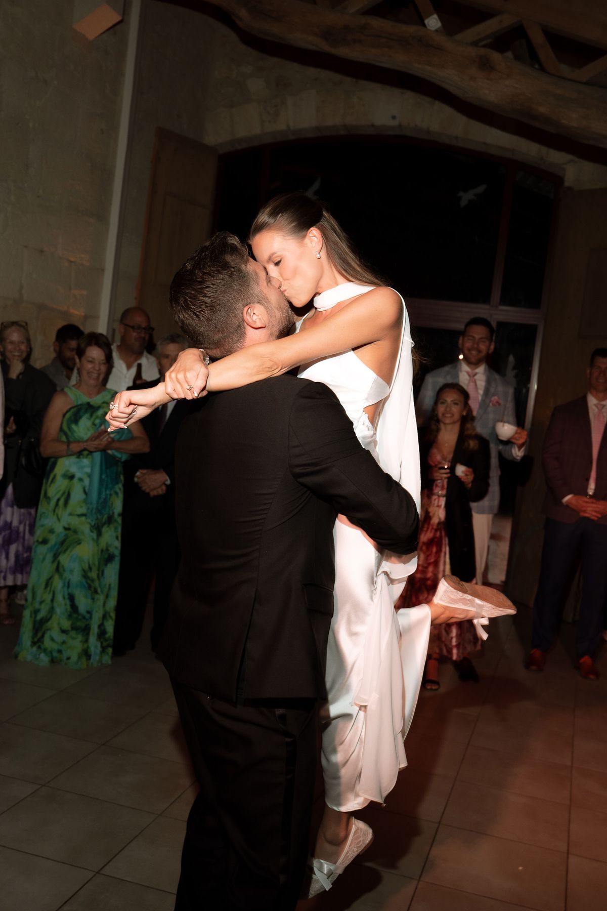 Jori and JD dancing on a packed indoor dance floor in the evening