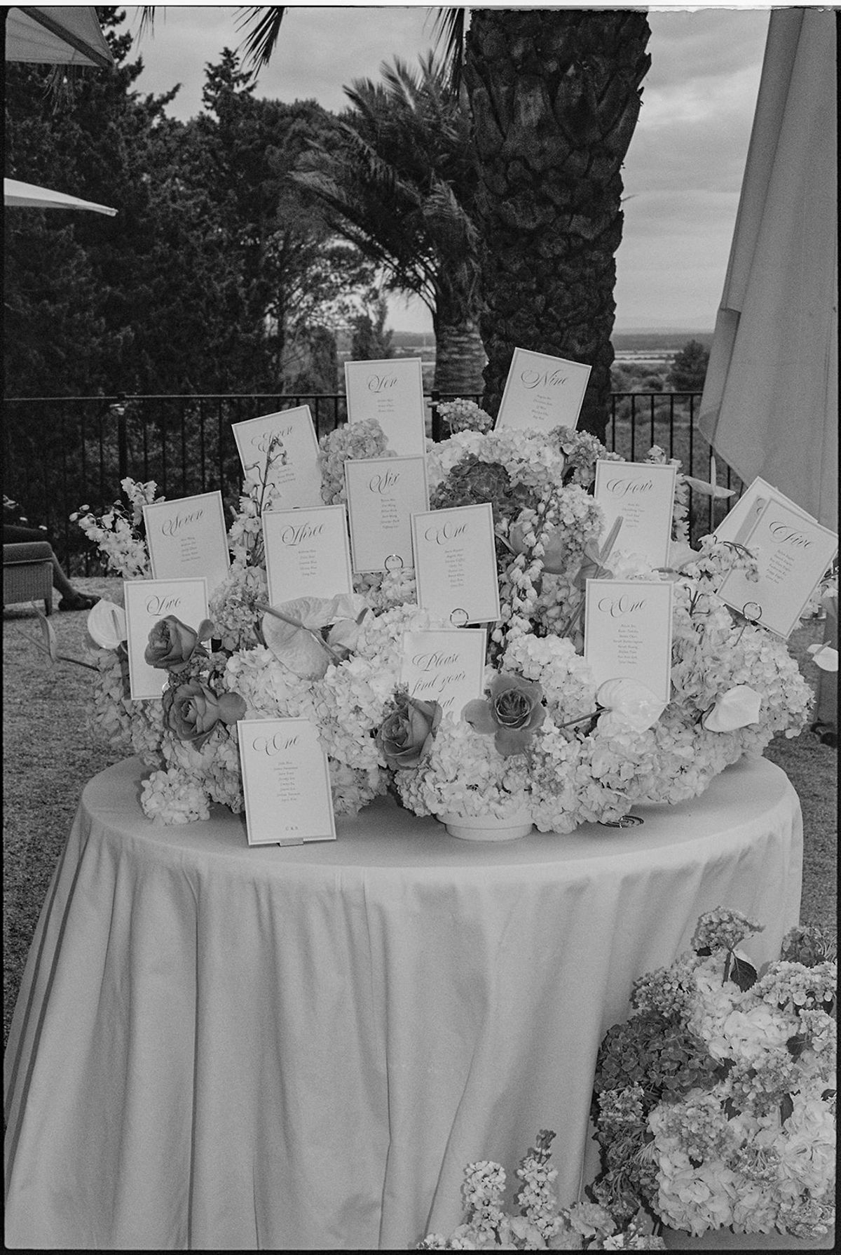 Black and white view of the escort card display on its round table