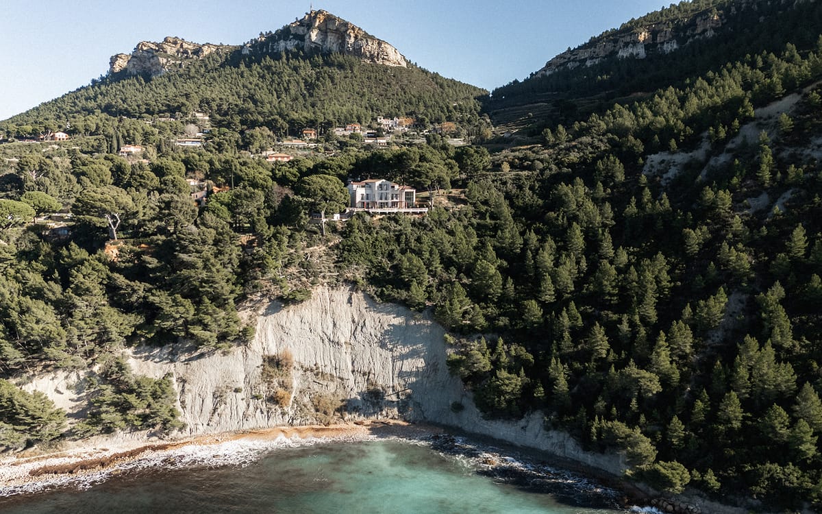 An aerial view of the limestone cliffs and pine forest along the Cassis coastline near the estate.