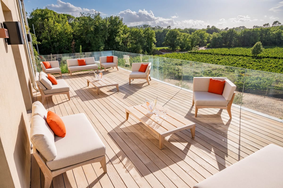 Domaine de Blacailloux modern terrace deck with lounge seating overlooking Provence vineyards
