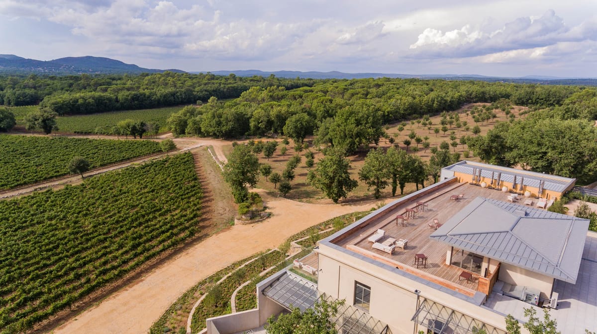 Aerial wide shot of Domaine de Blacailloux bastide and vineyards in Provence