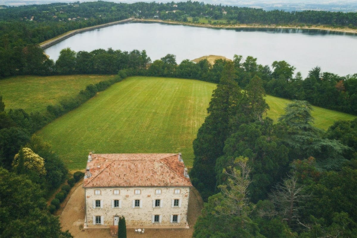 Aerial view of the château on its private estate beside Lac de Saint-Ferréol.