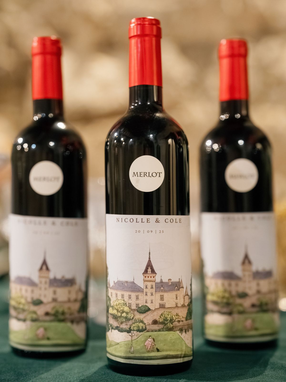 Bottles of red wine with custom labels showing a drawing of the château
