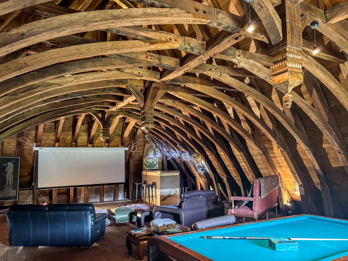 Vaulted timber and stone reception hall at Chateau Eyparsac