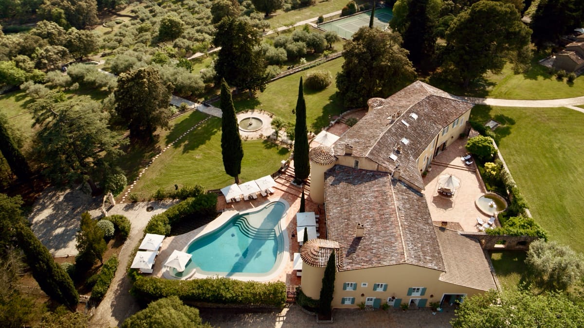 Aerial view of Chateau les Crostes with its pool terrace, gardens and tennis court