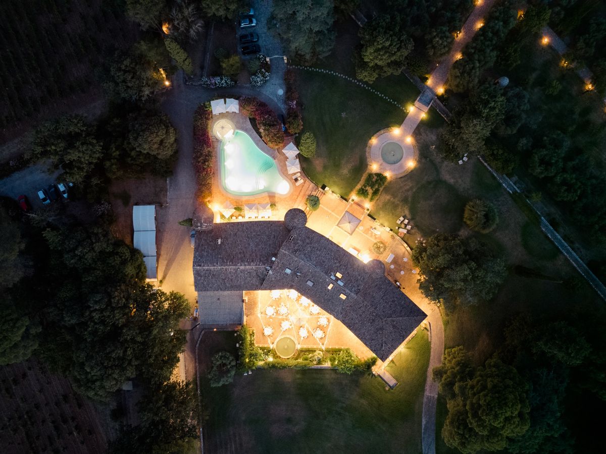 Night aerial of the Chateau les Crostes estate and floodlit pool