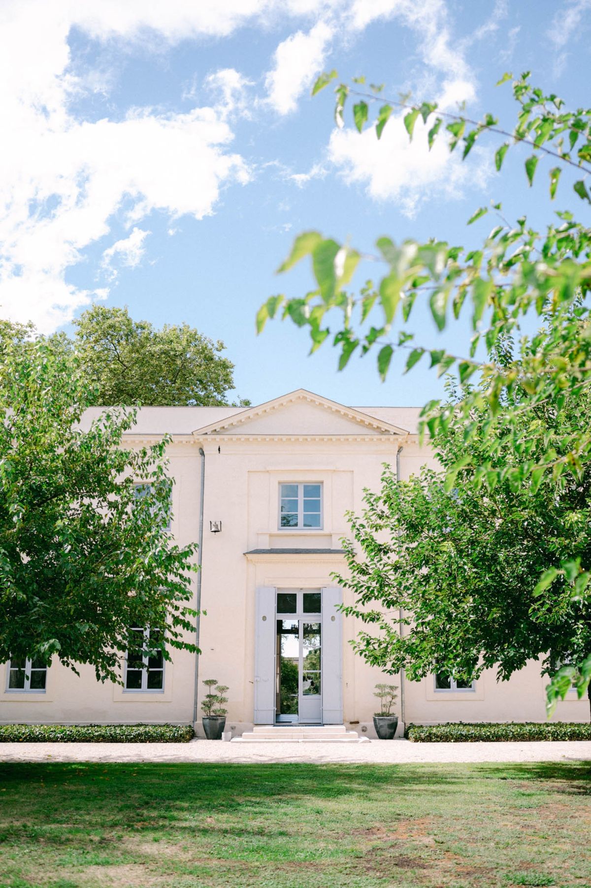Neoclassical facade of Chateau de l'Hospital designed by Victor Louis, with pediment and sash windows