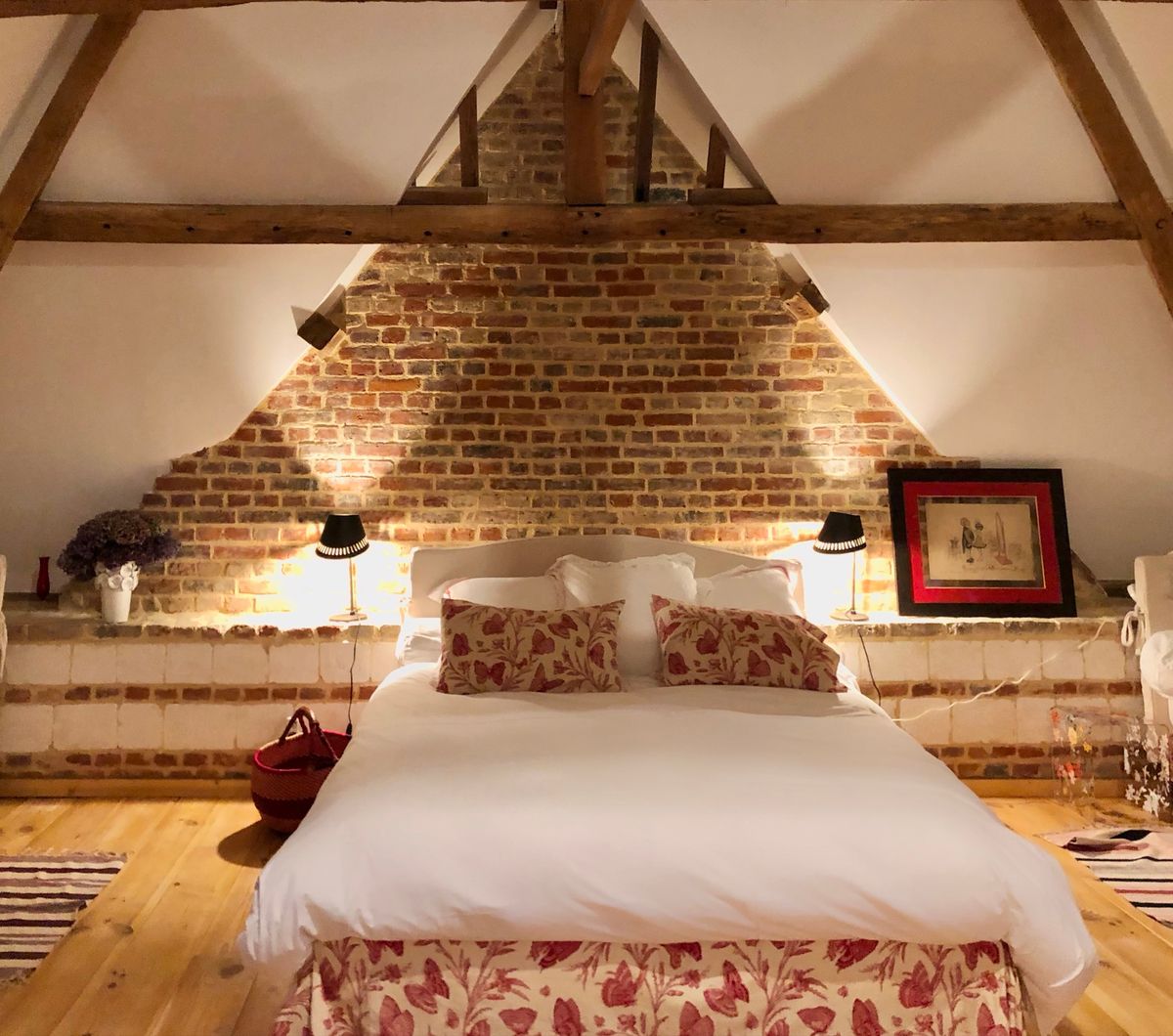 The Chambre des Papillons, an attic bedroom under the brick gable with a butterfly print valance