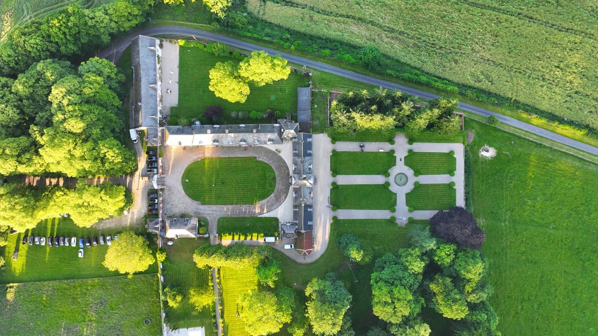 Overhead aerial of the château courtyard and the symmetrical formal garden
