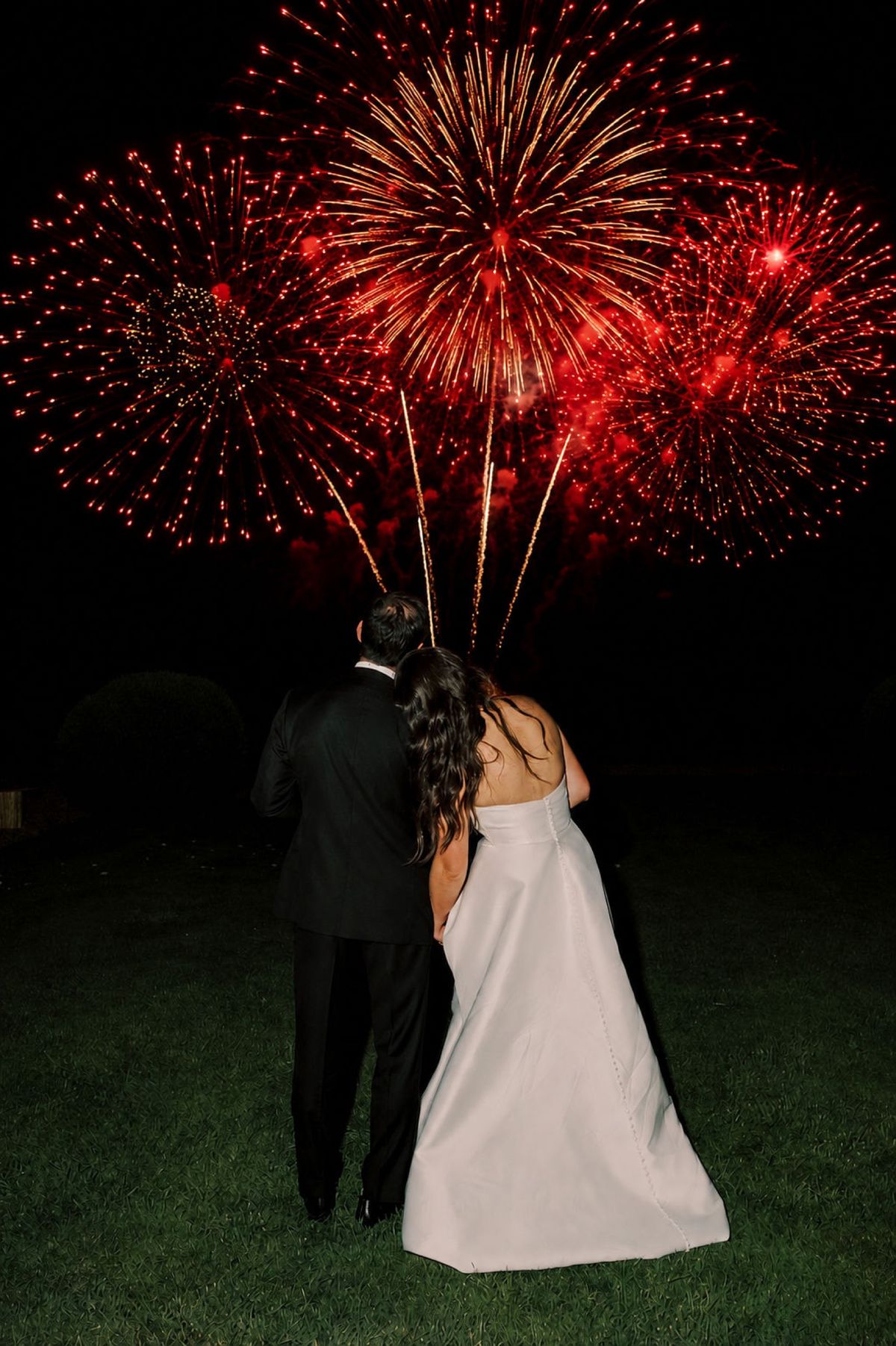 Fireworks over the grounds at night
