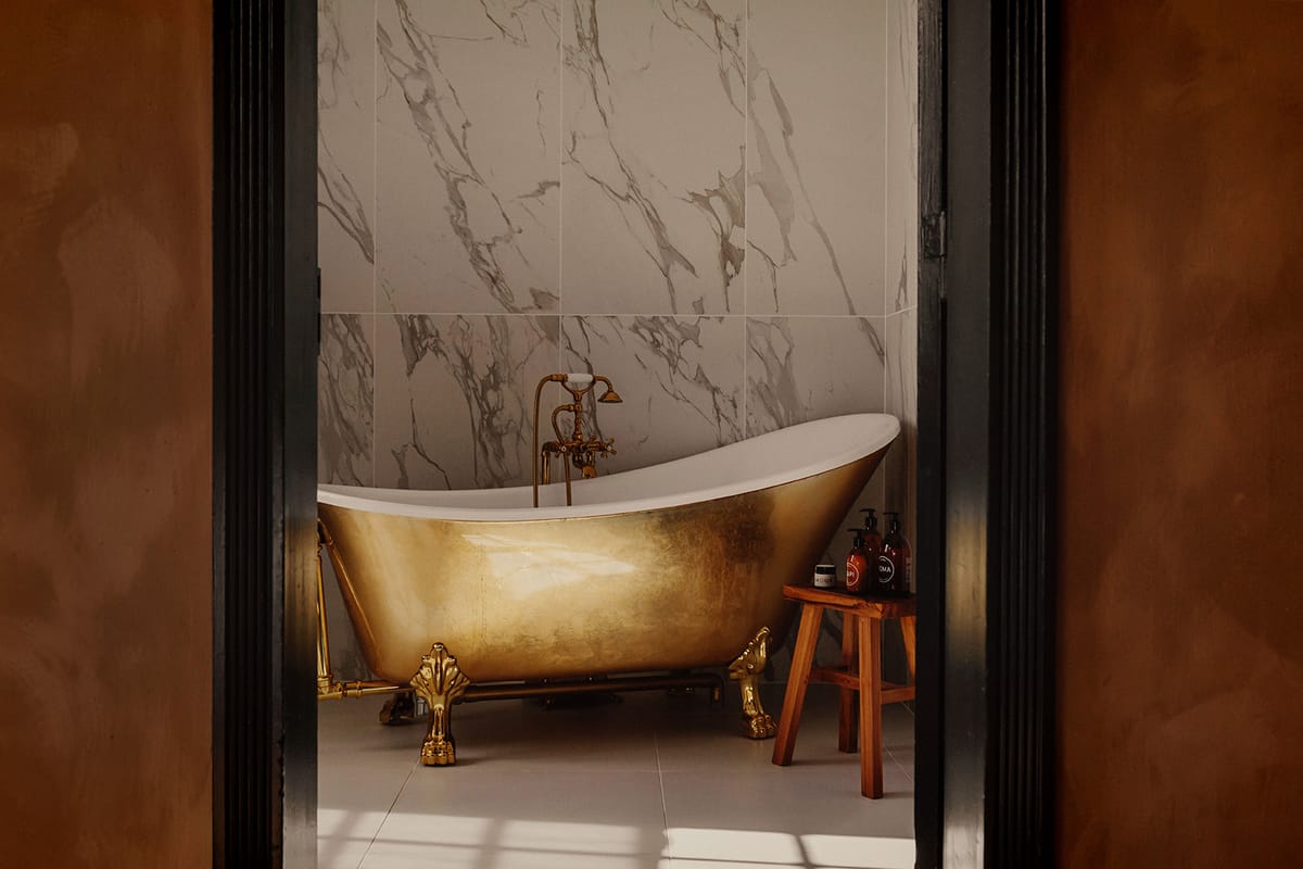 Château de Beaulieu — Bathroom — gold clawfoot tub