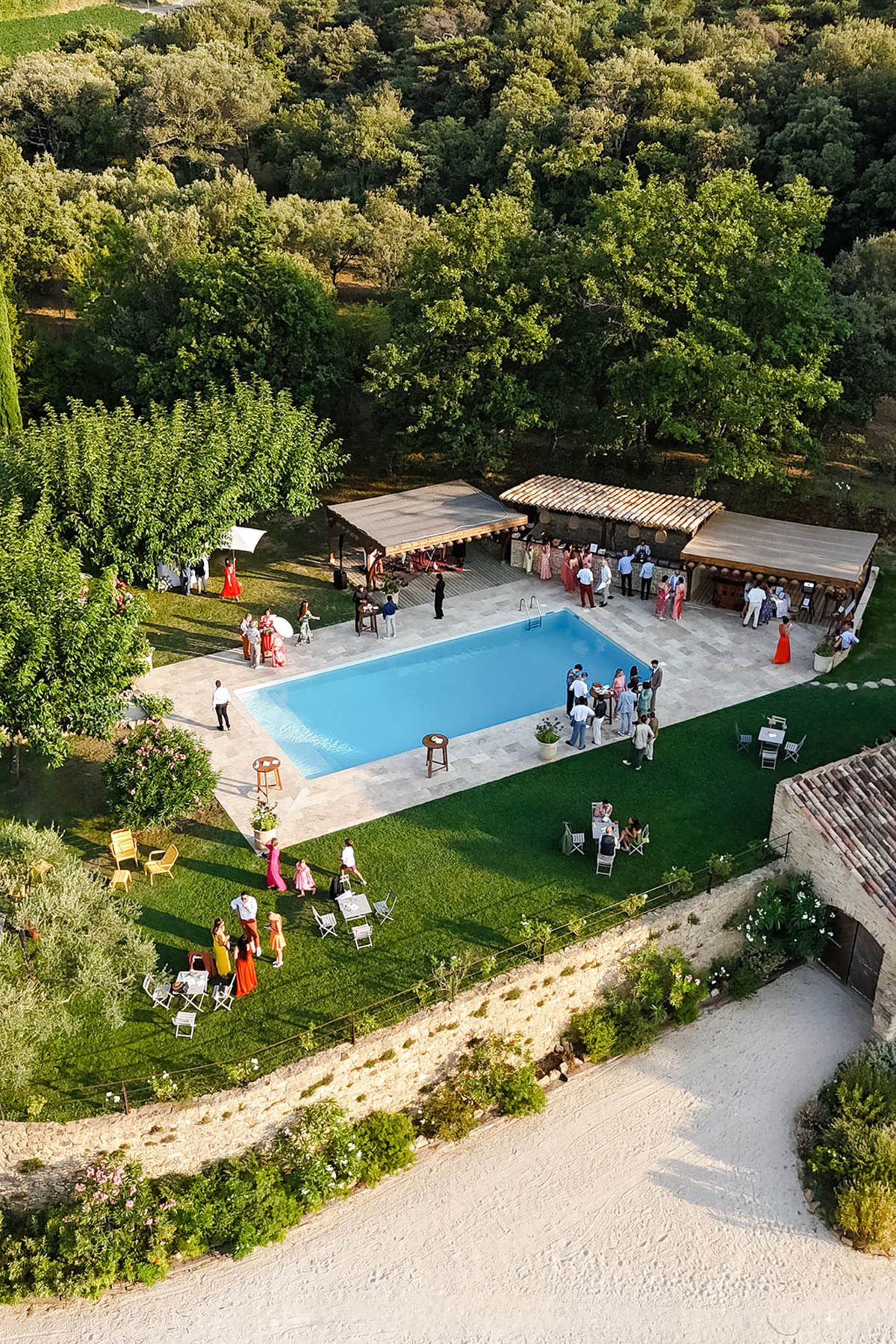 Aerial view of poolside cocktail hour guests at Domaine de Valbonne in Provence