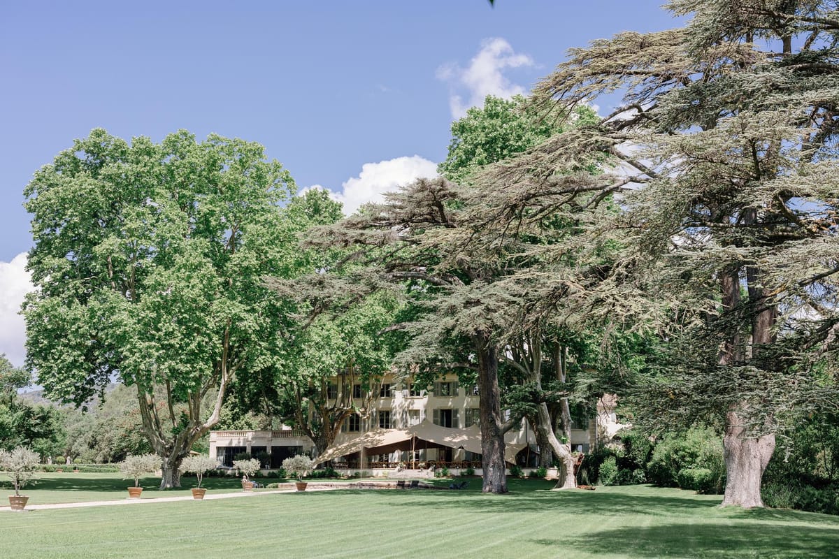 View of the chateau grounds framed by mature trees