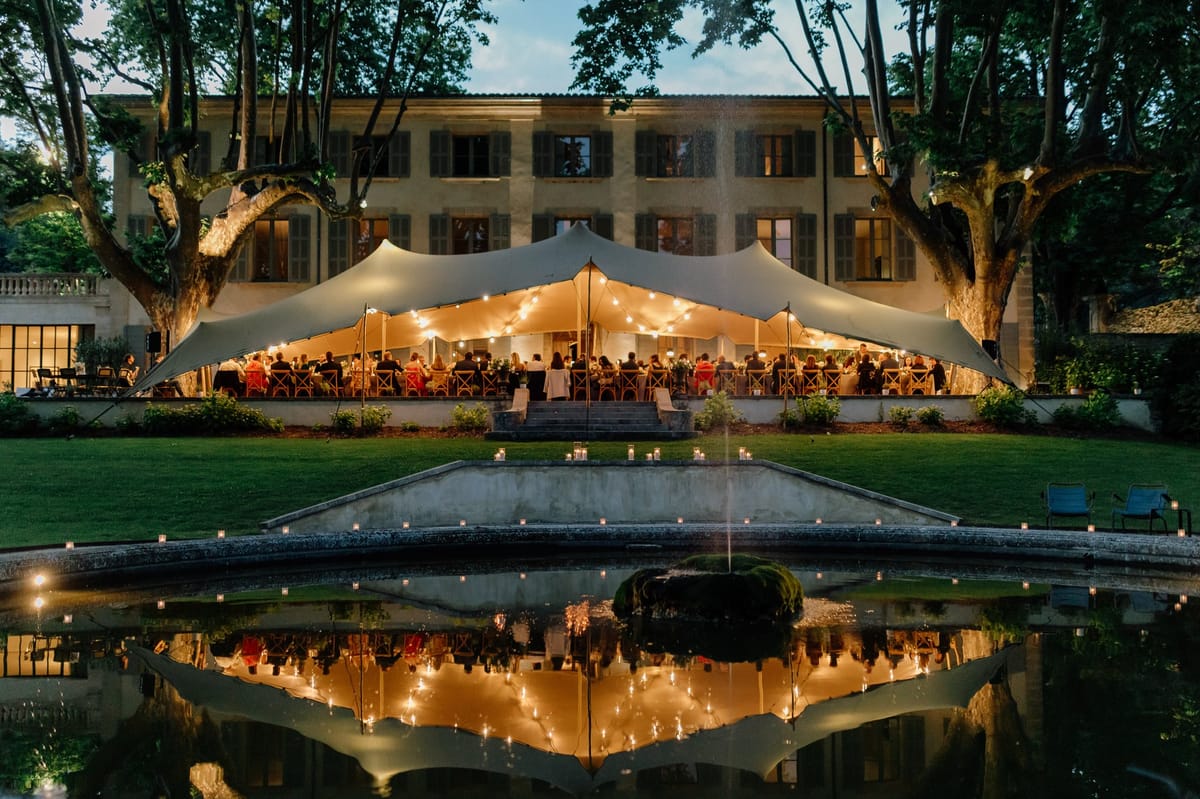 Reflecting pool and marquee illuminated at night