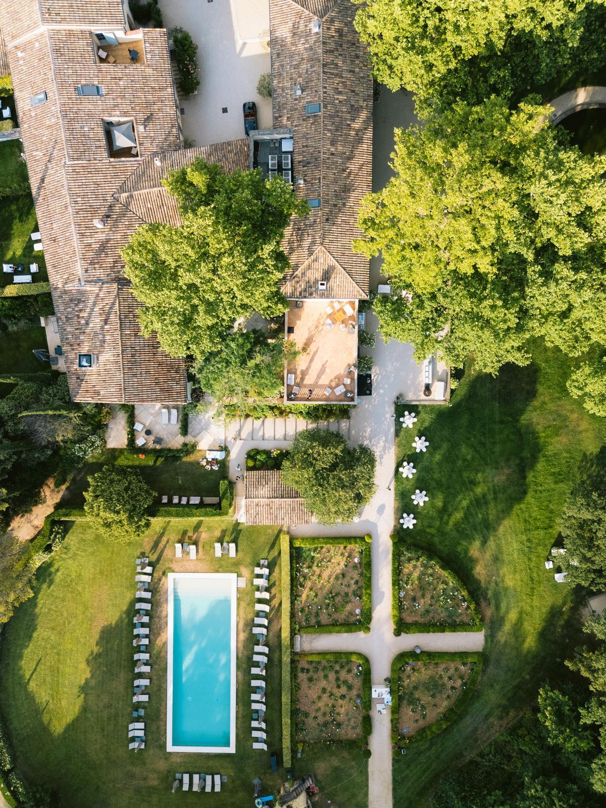 Aerial view of the chateau, pool and gardens at Domaine de Fontenille