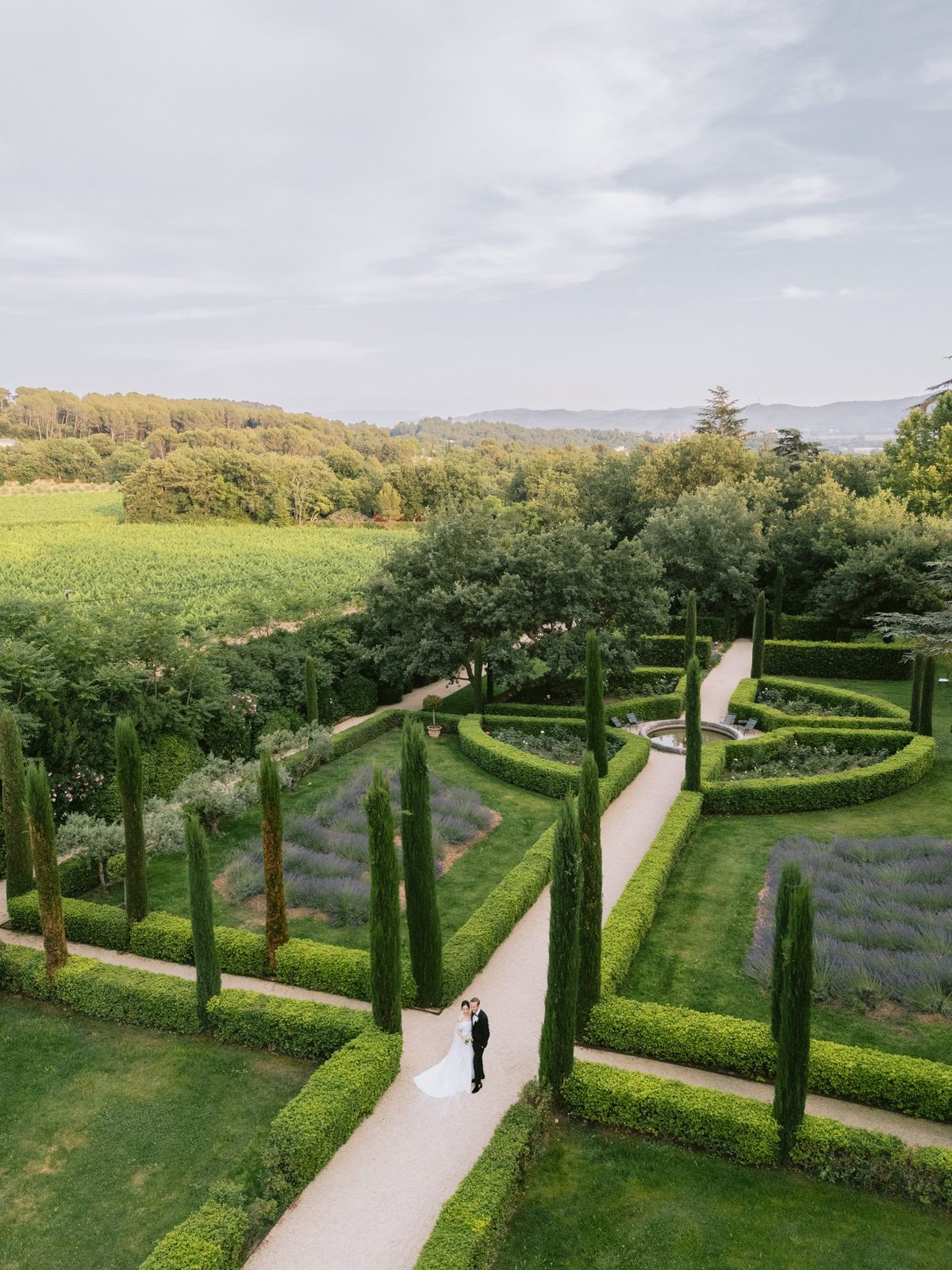 Aerial view of the formal clipped gardens and cypress-lined paths