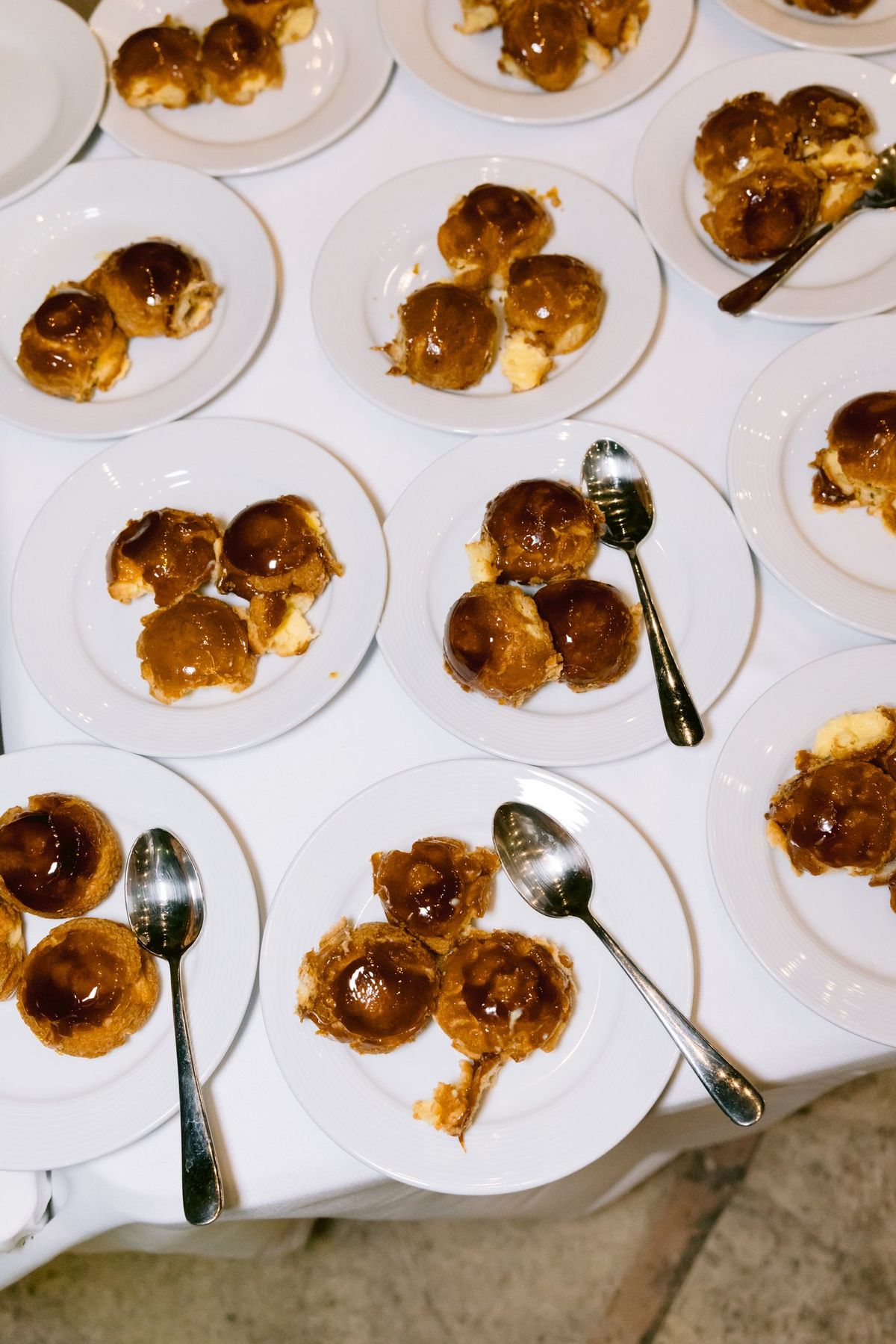 Choux pastries arranged on a serving table