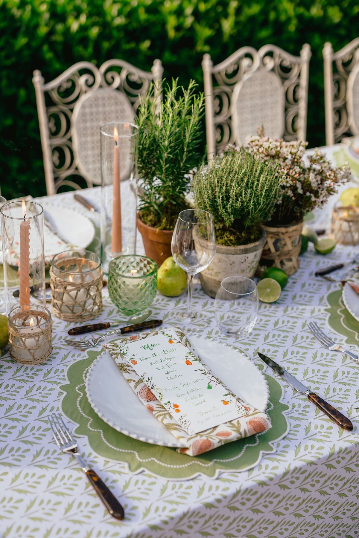 Table setting detail with rattan placemats and candles