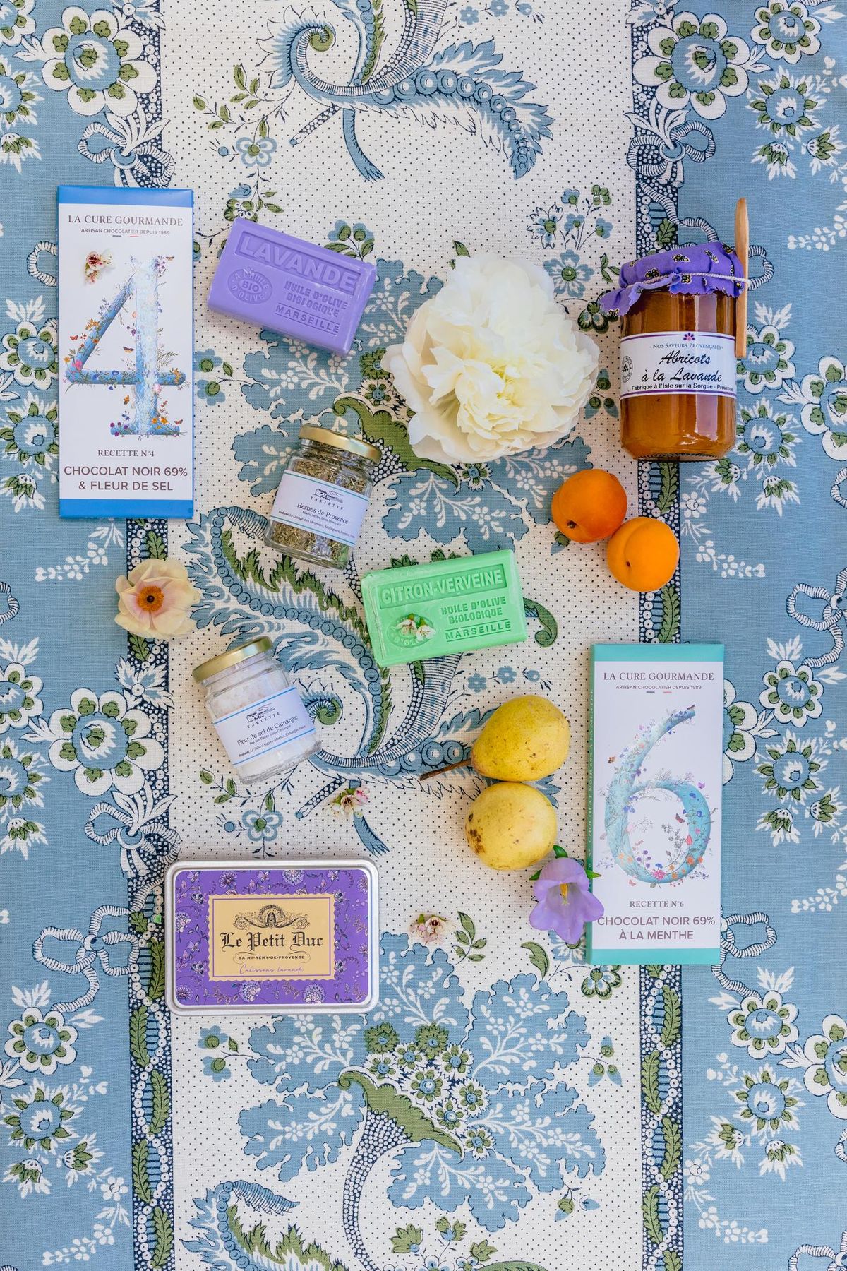 Wedding stationery flatlay on a patterned fabric