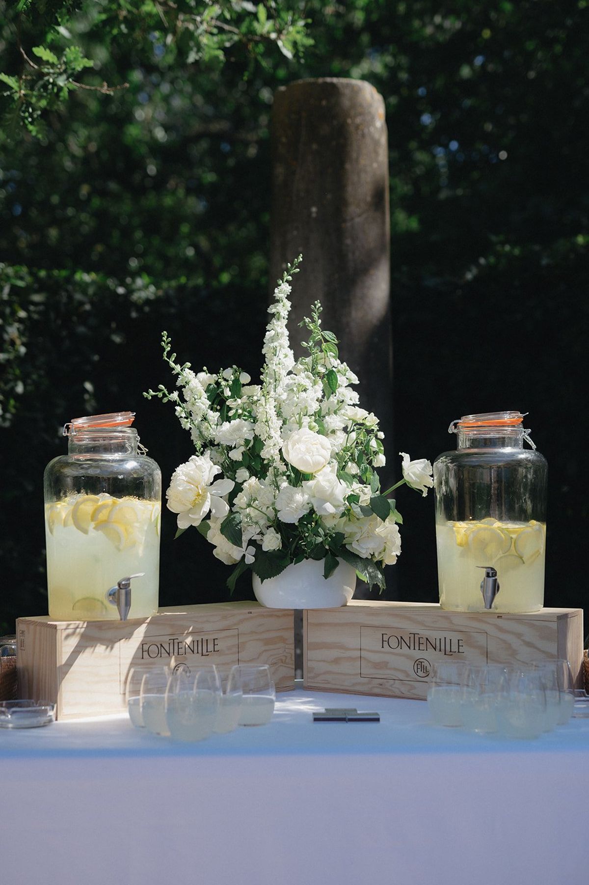 Branded drink dispensers set out on wooden crates