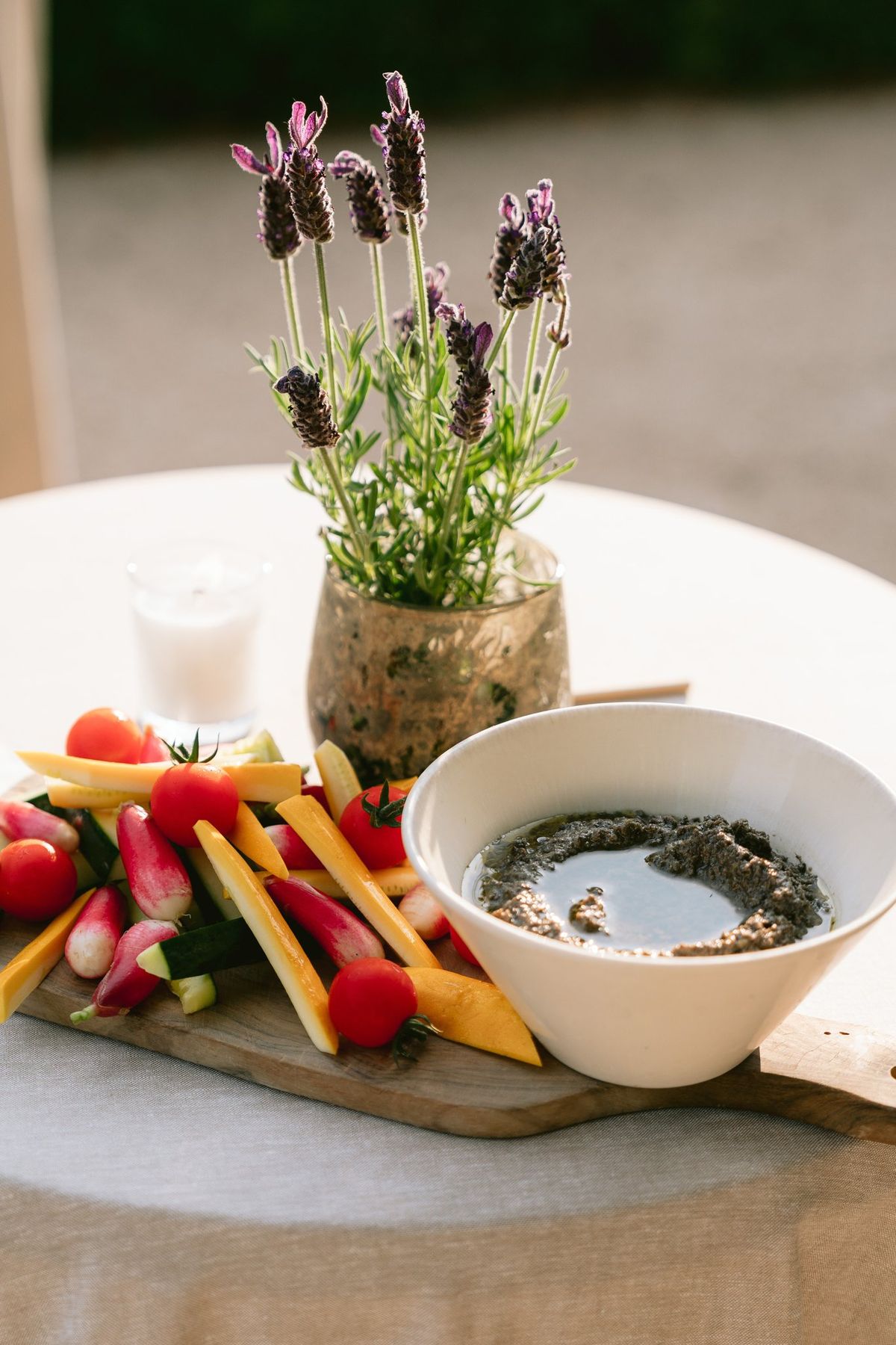 Lavender and crudites arranged on a garden table