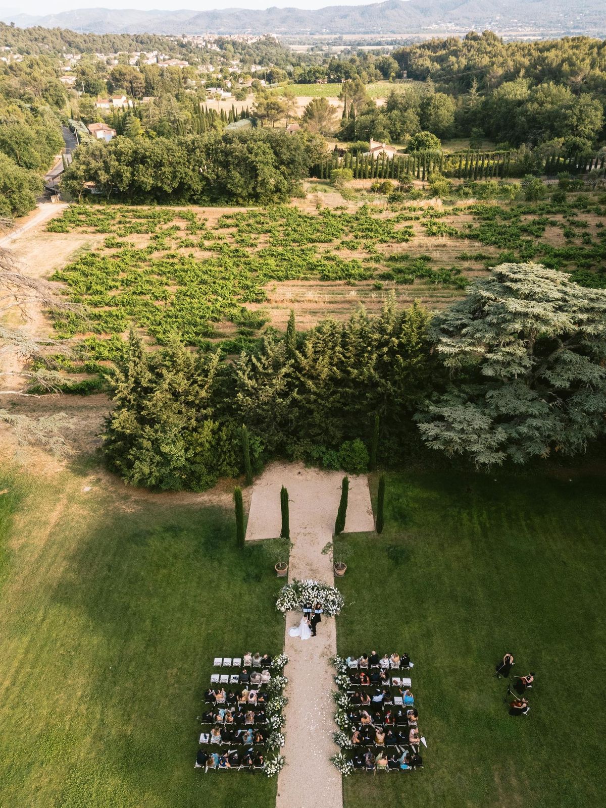 Aerial view of the ceremony aisle set across the lawn