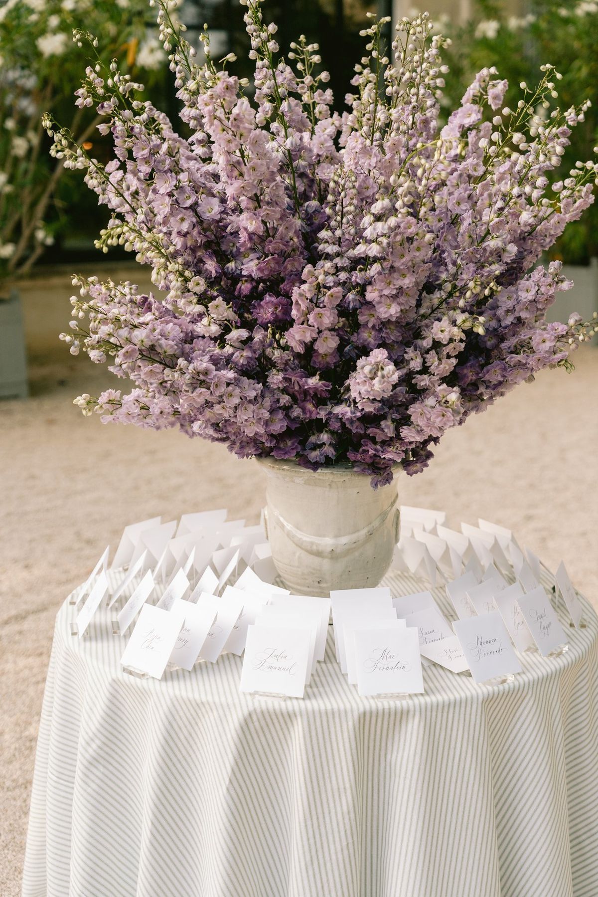 Floral centerpiece in a stone vase on a place-card table