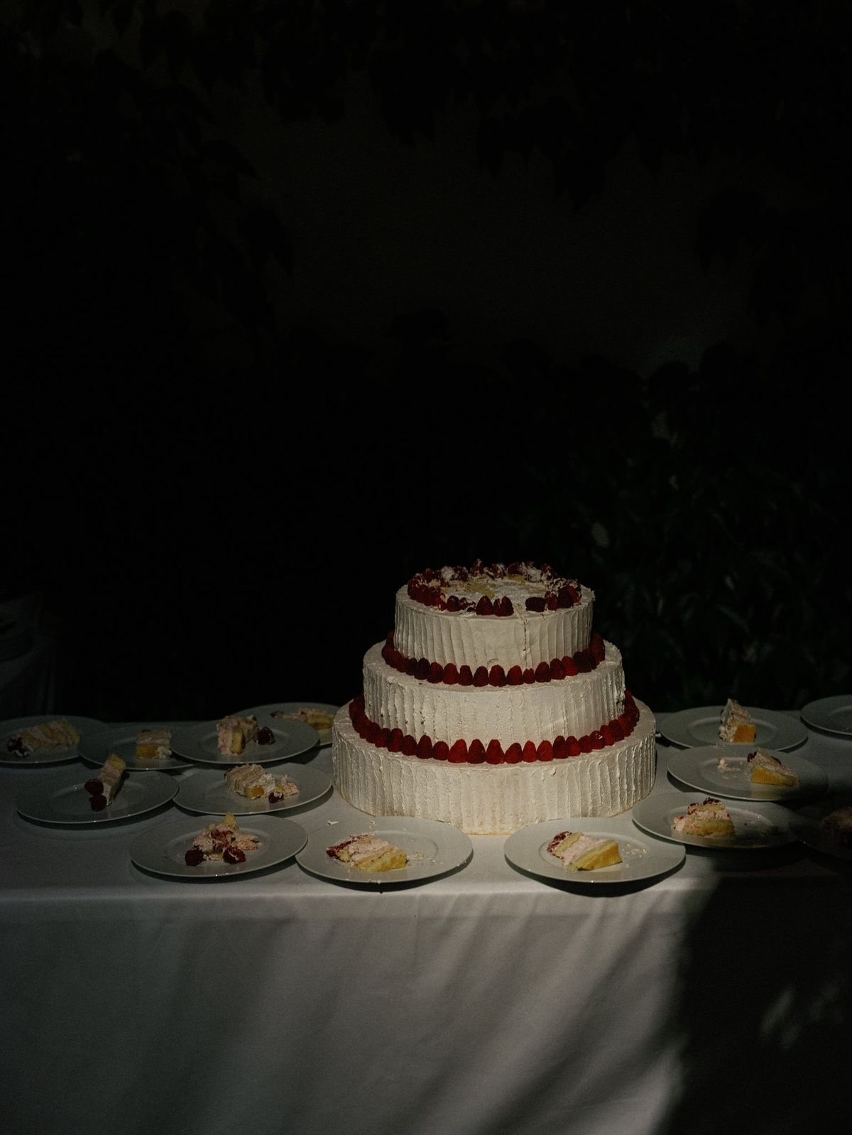 Tiered wedding cake decorated with berries