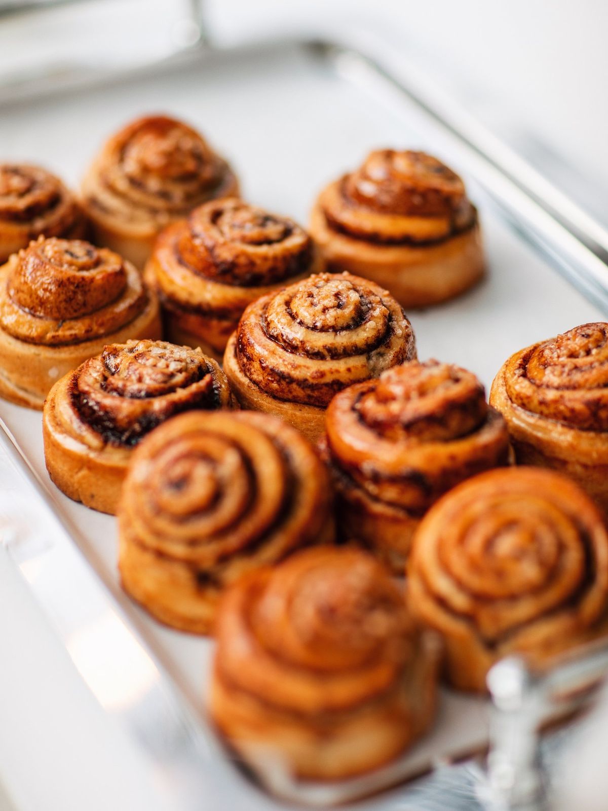 Cinnamon pastries arranged on a serving tray