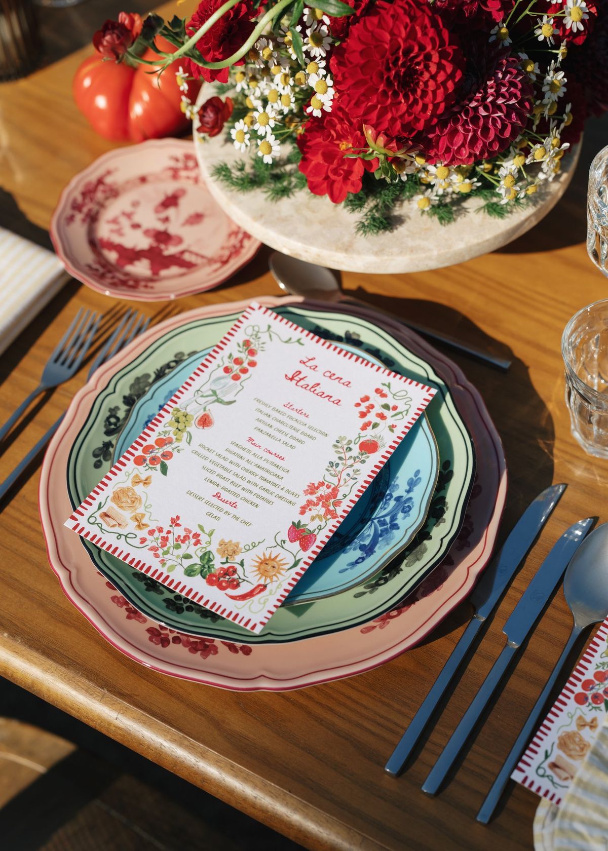 Place setting with floral menu card and fresh flowers