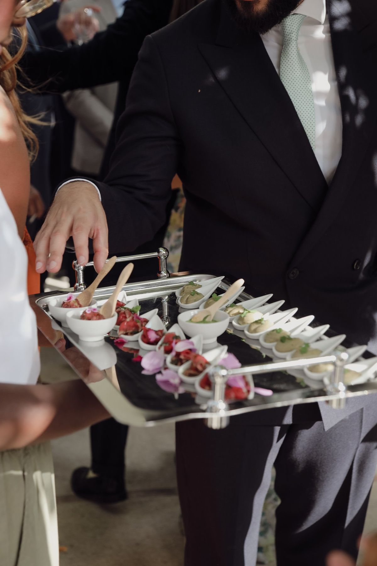 Dessert being placed on a serving tray