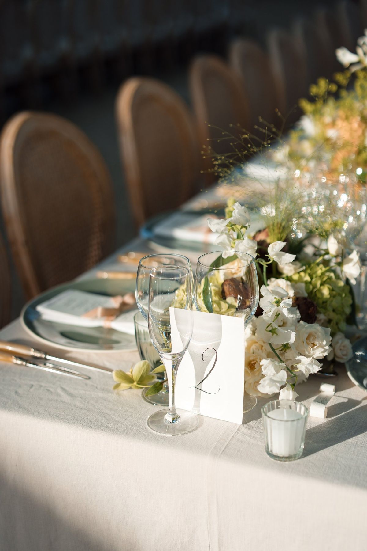 Table setting with fresh flowers and place cards