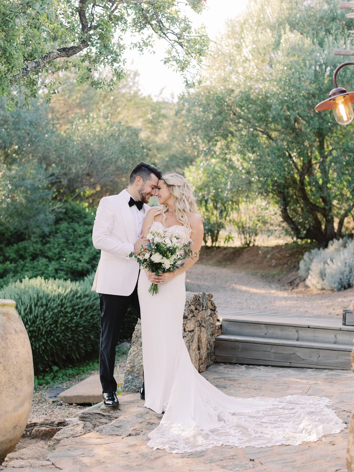 Couple on the garden path through the olive grove at Les Oliviers de Palombaggia