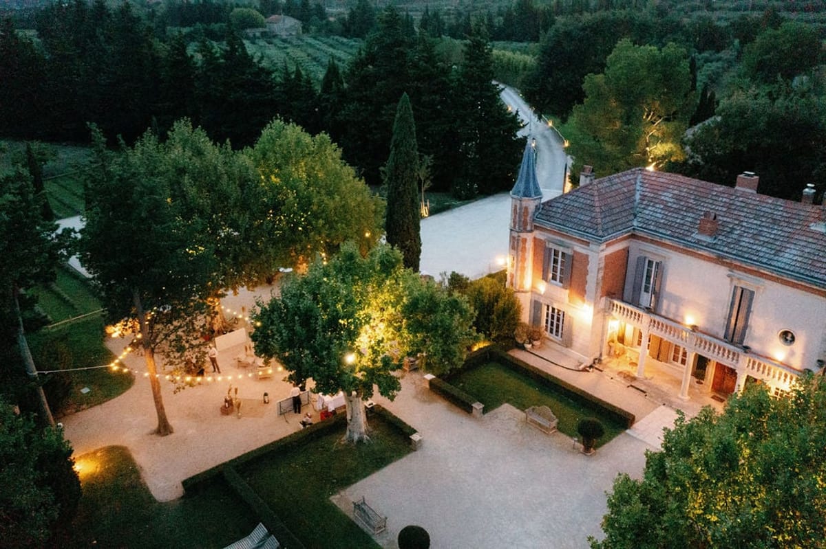 Aerial daytime view of Mas D'Arvieux chateau, pool and surrounding grounds