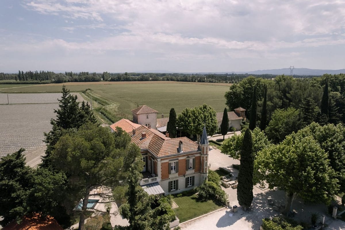 Aerial view of Mas D'Arvieux chateau with lavender rows in the foreground