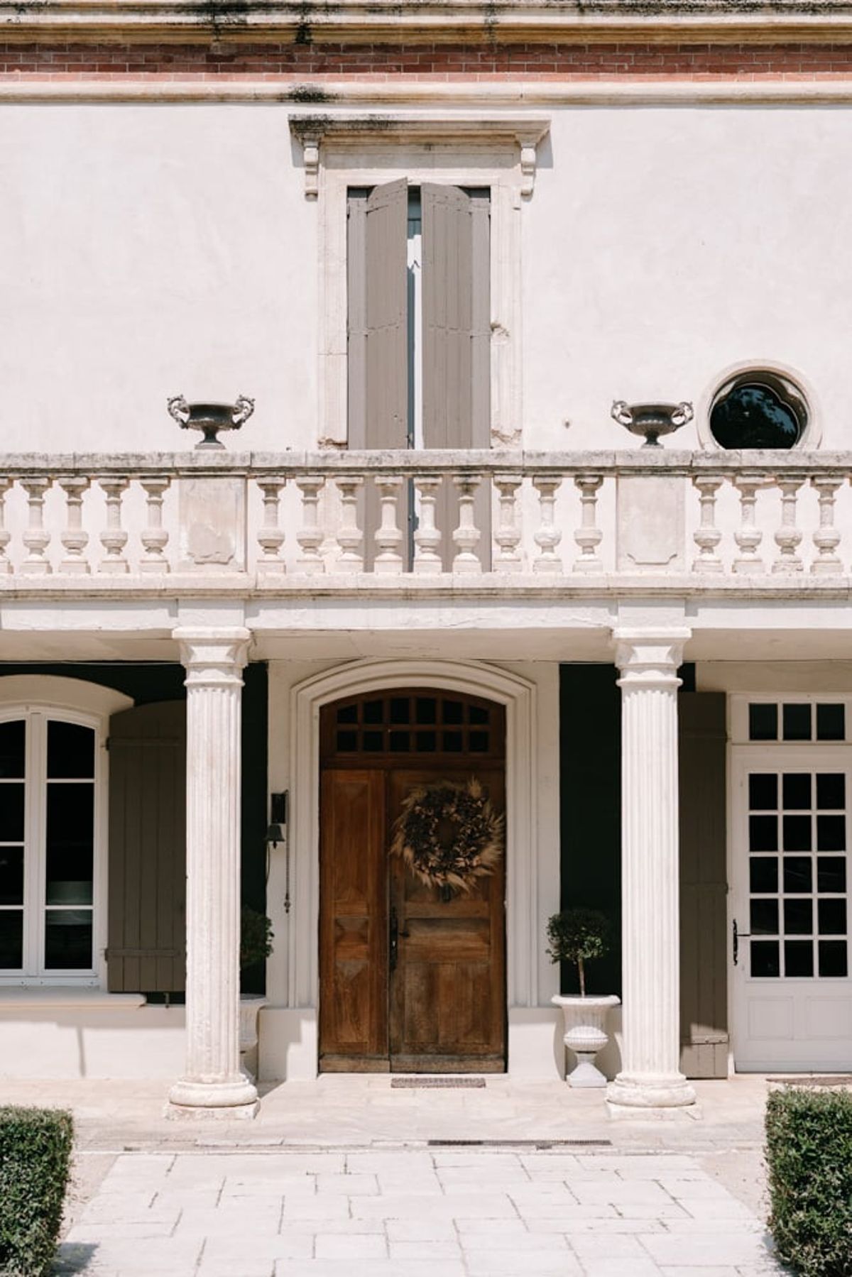 Mas D'Arvieux entrance colonnade and wooden front door