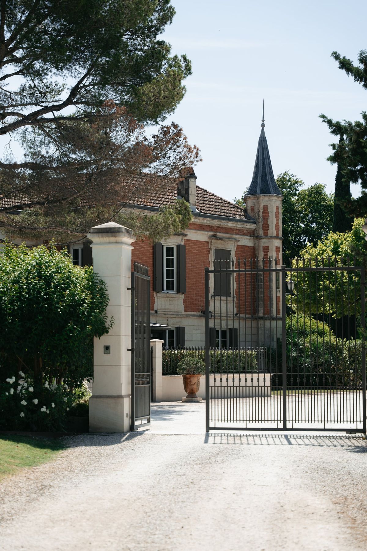 Mas D'Arvieux entrance gate and turret seen from the driveway