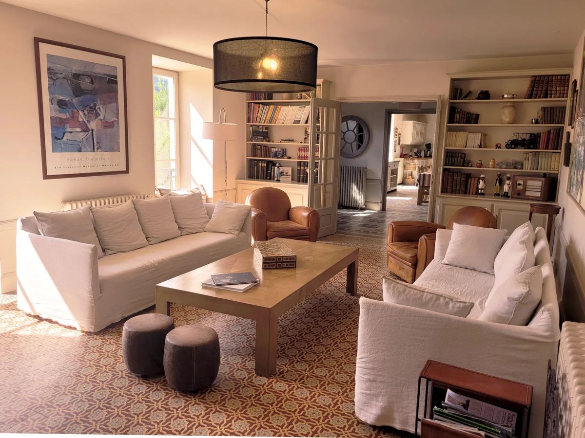 Farmhouse kitchen and dining room at Domaine de Vavril with patterned tiled floors