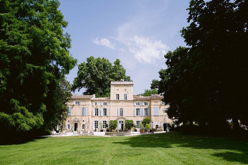 Full facade of Chateau des Barrenques from lawn Provence