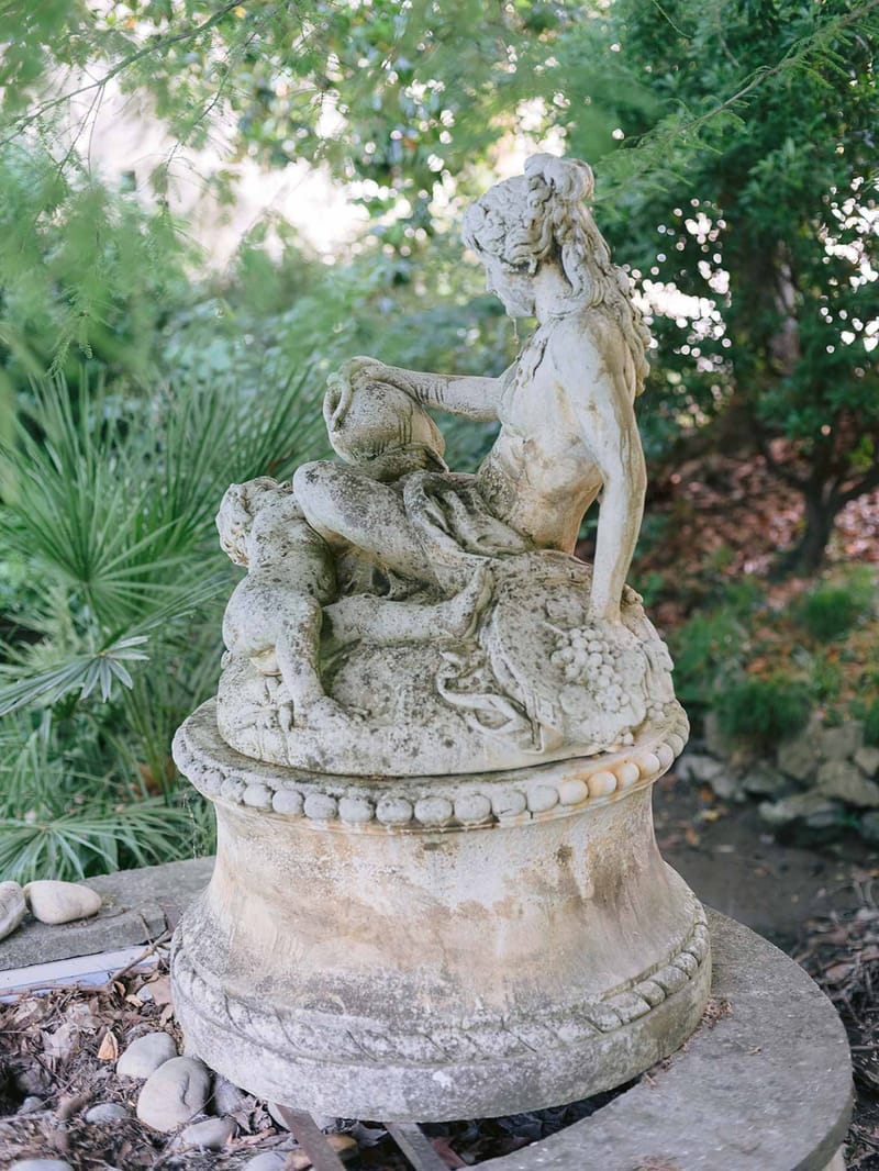 Classical stone statue in gardens at Chateau des Barrenques Provence